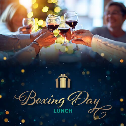 Family and friends toasting the Boxing Day lunch