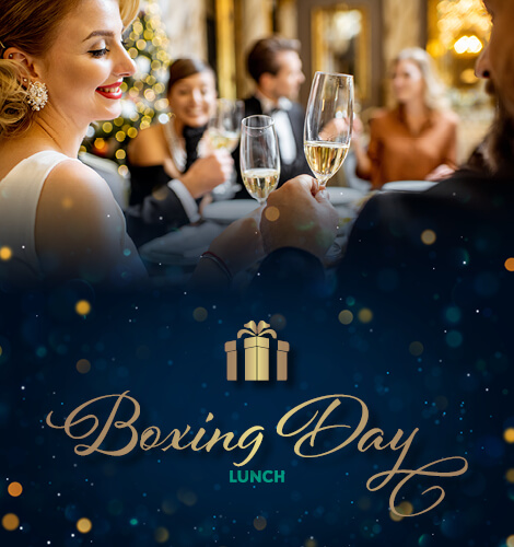 Festive family and friends in smart attire, toasting the Boxing Day lunch