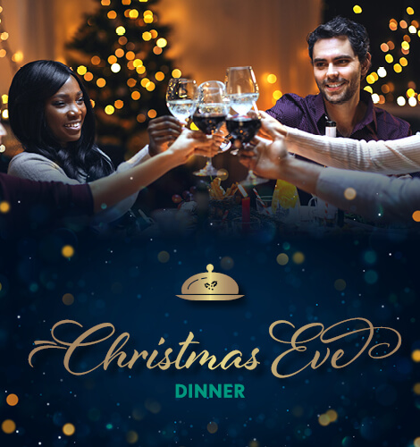 Friends sitting around festive table and toasting Christmas eve