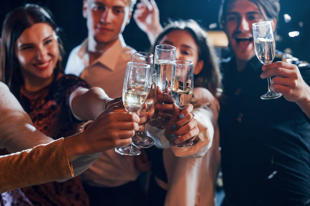 Group of work colleagues celebrating Christmas after party